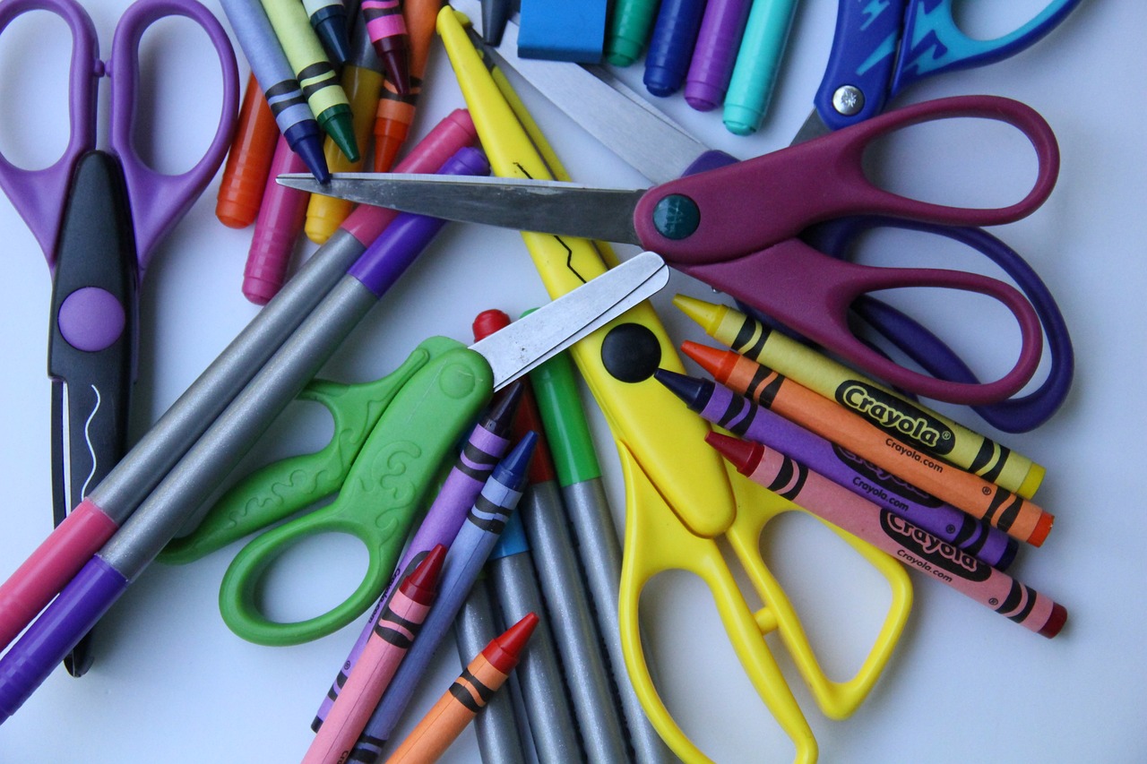 Markers, crayons, and scissors in multicolors