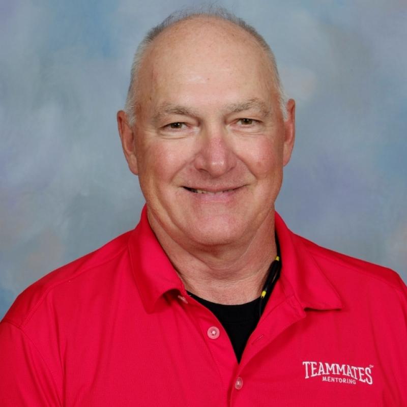 Photo of Dave Duncan wearing a red shirt with collar