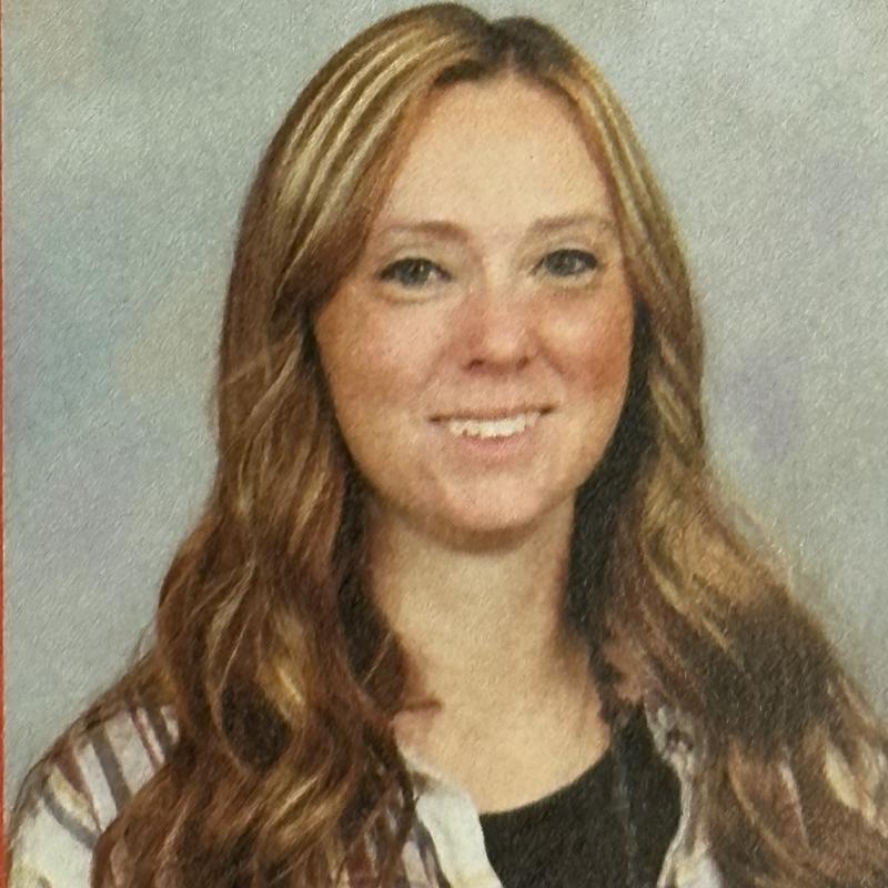 photo of Brittney Smith wearing brown plaid shirt over black shirt