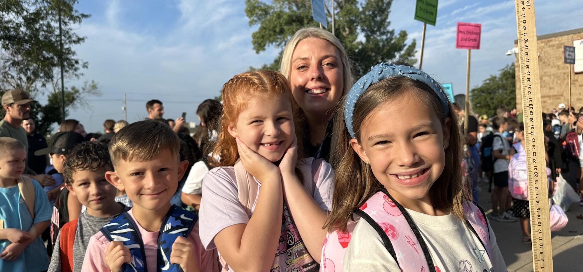 students and teacher on first day of school