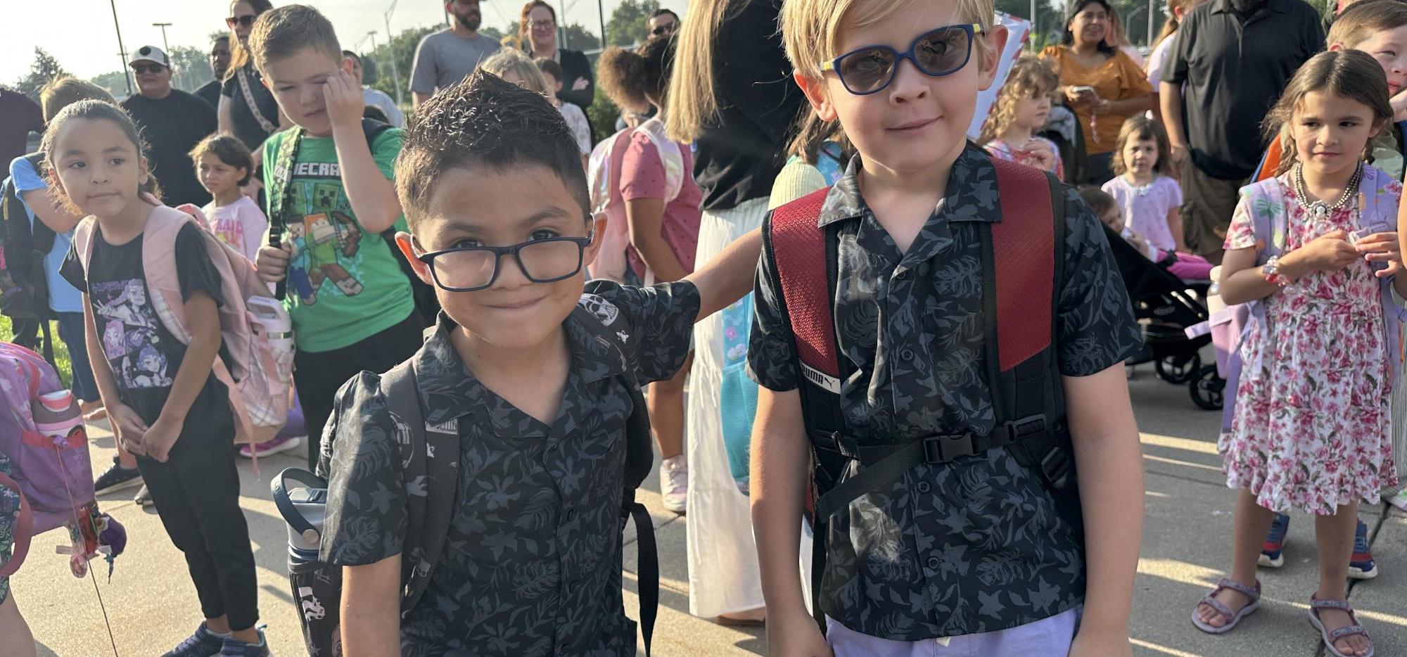students in matching dinosaur shirts
